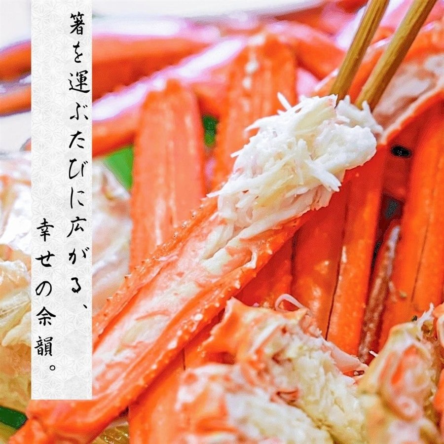 箸でつまみ上げた、ほぐれる蟹の身。茹で蟹の断面と身のふっくらとした質感